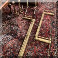D22. Brass fireplace fenders and andirons. 